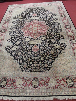 Lot 1381 - A Persian woollen Kirman pictorial carpet, the...