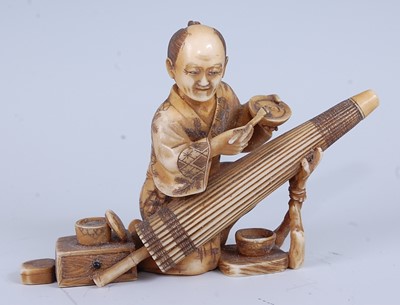 Lot 2325 - A Japanese Meiji period carved ivory okimono,...