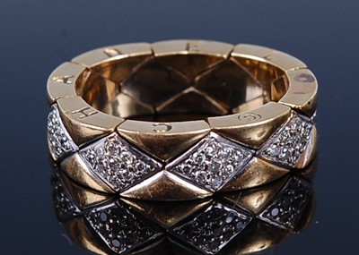 Lot 2231 - A Chanel Matelasse yellow metal flexible ring,...