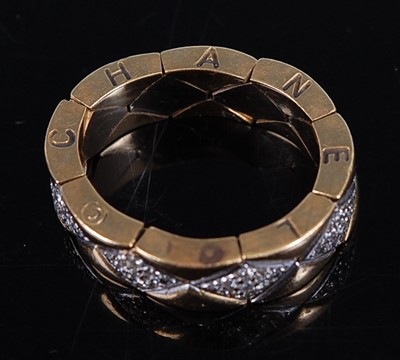 Lot 2231 - A Chanel Matelasse yellow metal flexible ring,...
