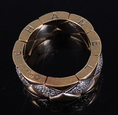 Lot 2231 - A Chanel Matelasse yellow metal flexible ring,...