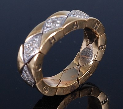 Lot 2231 - A Chanel Matelasse yellow metal flexible ring,...