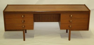 Lot 550 - A 1960s teak low kneehole sideboard by White &...