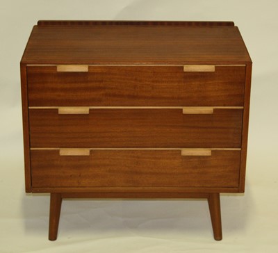 Lot 574 - A 1960s teak low chest of three long...