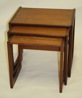 Lot 540 - A 1970s G-Plan teak nest of three occasional...