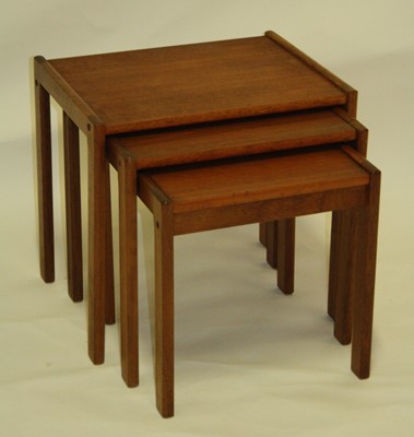 Lot 541 - A 1970s teak nest of three occasional...