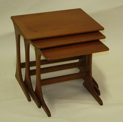 Lot 542 - A late 1960s G-Plan teak nest of three...