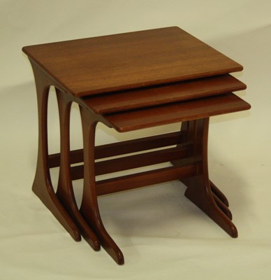 Lot 543 - A late 1960s G-Plan teak nest of three...