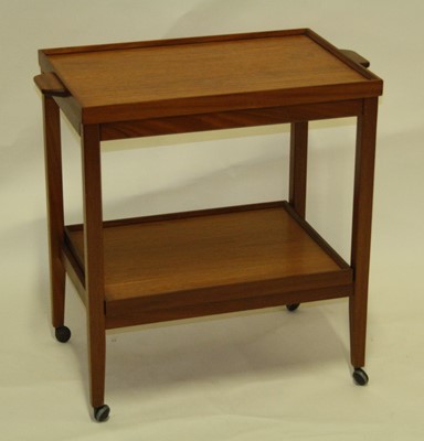 Lot 544 - A 1970s teak two-tier serving trolley, the...