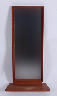 Lot 579 - A small 1960s teak mirrored wall shelf, with...