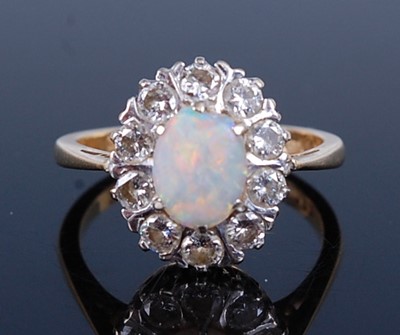 Lot 2228 - An 18ct yellow and white gold, opal and...