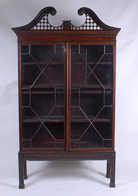 Lot 2511 - After Chippendale - a mahogany bookcase on...