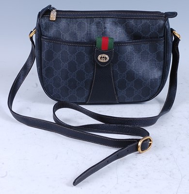 Lot 305 - A Gucci canvas and leather trim shoulder bag,...