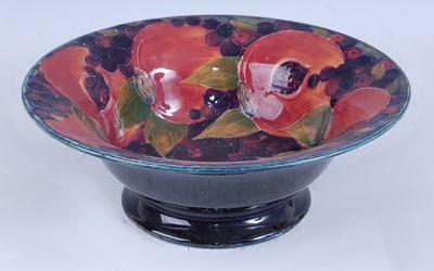 Lot 77 - A Moorcroft Pomegranate pattern footed...