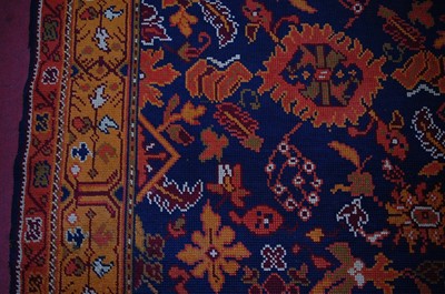 Lot 2451 - An Arts & Crafts Donegal woollen rug, the blue...