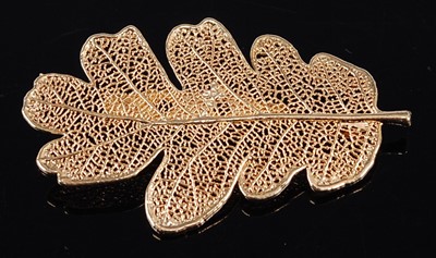Lot 276 - A contemporary fine yellow gold filigree leaf...
