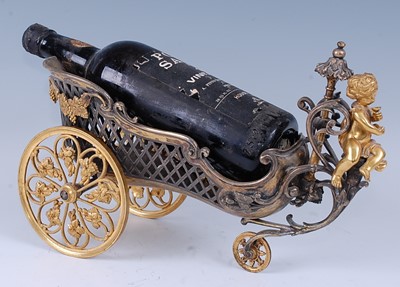 Lot 2306 - An early 20th century gilt metal wine bottle...
