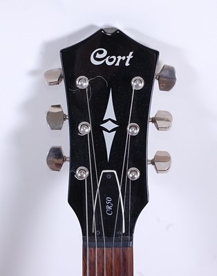 Lot 1002 - A Cort CR50 six string electric guitar in...