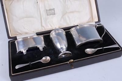 Lot 2145 - A George V silver three-piece cruet set, in...