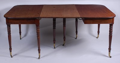 Lot 2499 - A George III mahogany double D-end dining...