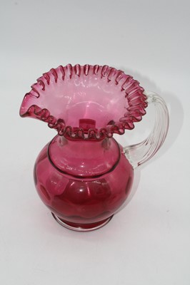 Lot 4 - A Victorian cranberry glass water jug, the...