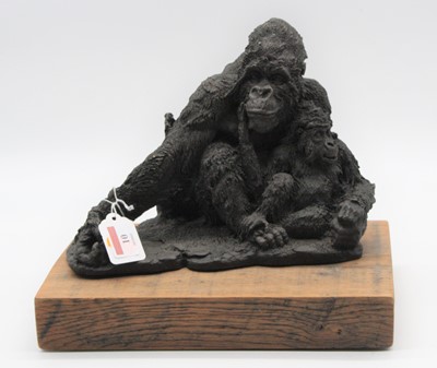 Lot 10 - A bronzed model of a gorilla and its baby,...