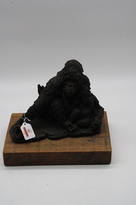 Lot 10 - A bronzed model of a gorilla and its baby,...