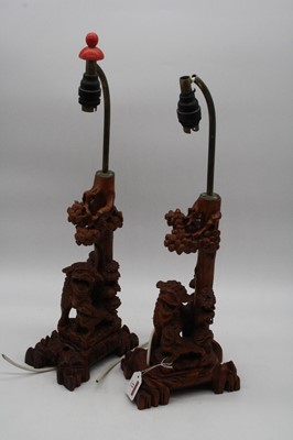 Lot 11 - A pair of 20th century carved wood table lamps,...