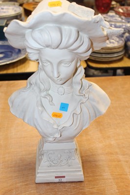 Lot 12 - A Victorian style composition bust of a young...
