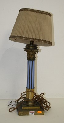 Lot 34 - An early 20th century brass and coloured glass...