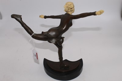 Lot 50 - An Art Deco style bronze and resin figure of a...