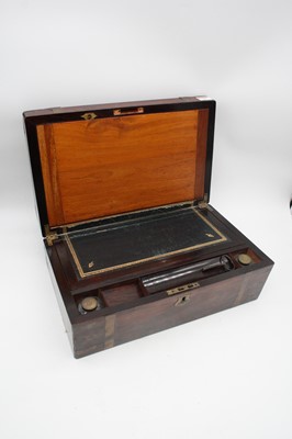 Lot 53 - A Victorian rosewood and brass mounted writing...