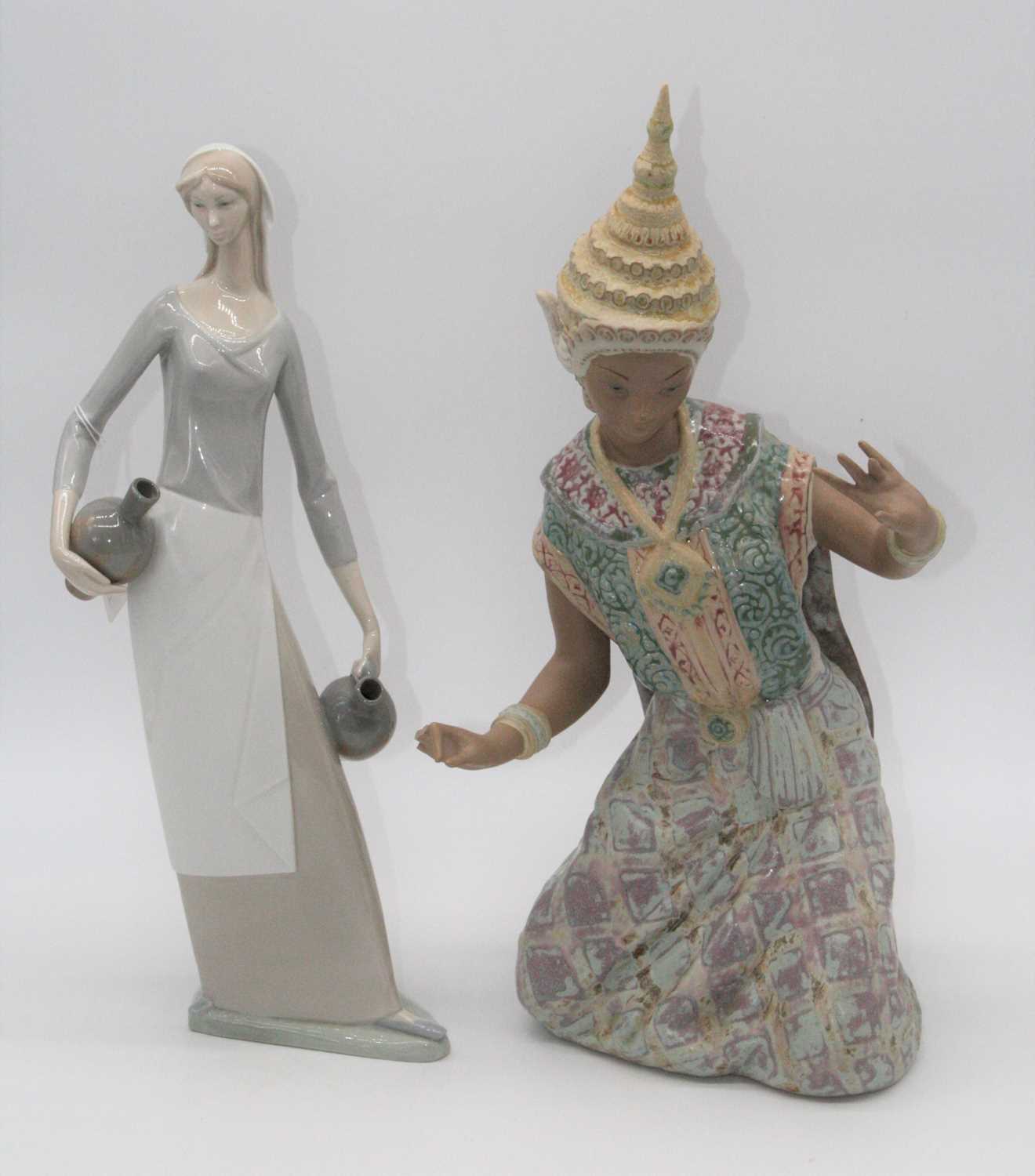 Lot 63 - A Nao porcelain figure of a woman, height...