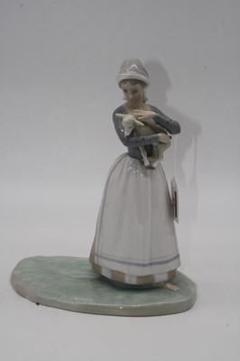 Lot 67 - A Lladro porcelain figure of a young girl...