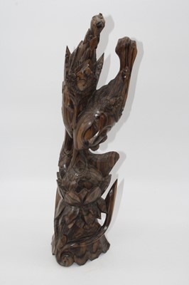 Lot 73 - An eastern carved hardwood figure group of a...
