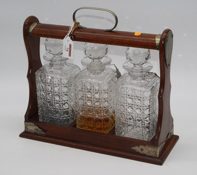 Lot 74 - A 20th century oak cased three bottle tantalus,...