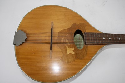 Lot 130 - An Italian marquetry inlaid eight string...