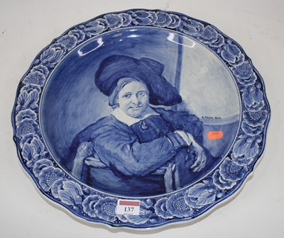 Lot 137 - A Dutch Delft charger decorated with a...