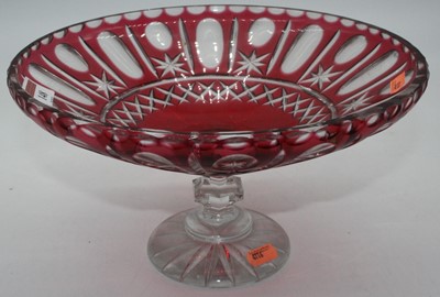 Lot 148 - A cranberry glass comport, with star cut...