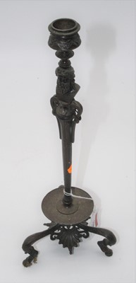 Lot 150 - A bronze table candlestick, the stem in the...