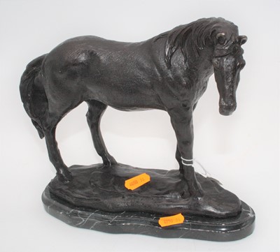 Lot 170 - A bronze model of a horse, shown in standing...
