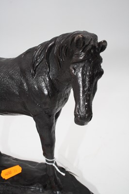 Lot 170 - A bronze model of a horse, shown in standing...