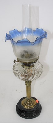 Lot 184 - A late 19th century brass oil lamp, the blue...