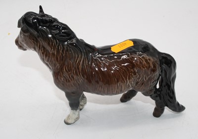 Lot 310 - A Beswick Shetland pony, model No. 1033, brown...