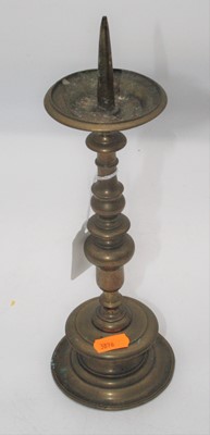 Lot 312 - An antique bronze pricket stick, the knopped...