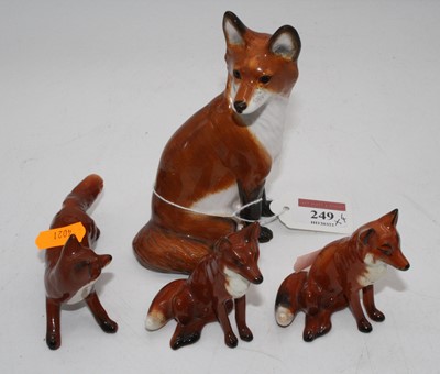 Lot 249 - A collection of Beswick models of foxes, the...