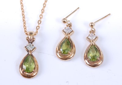 Lot 2522 - A yellow metal, peridot and topaz pendant and...