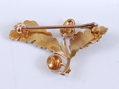 Lot 2523 - A yellow metal acorn and oak leaf brooch, set...