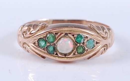 Lot 2524 - An Edwardian 9ct yellow gold, opal and emerald...