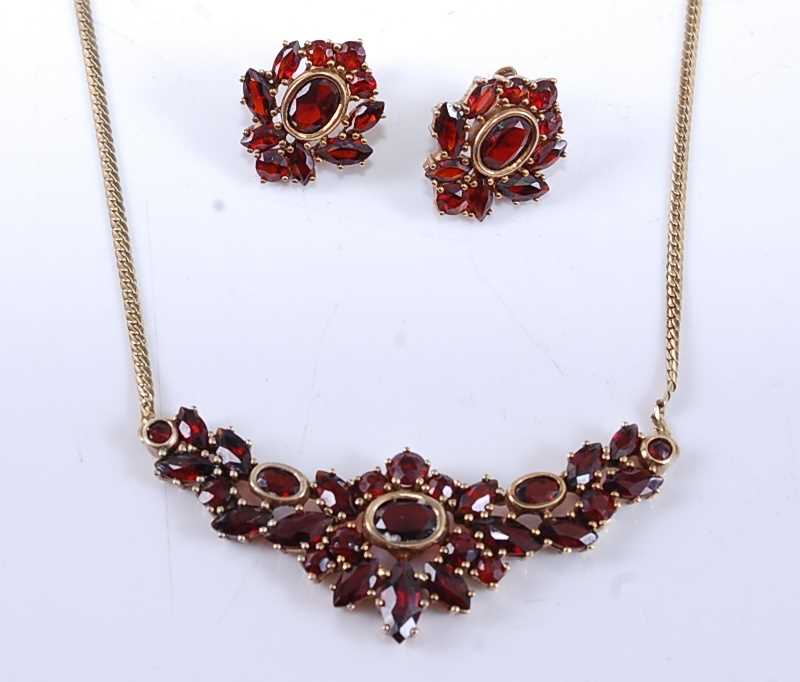 Lot 2535 - A yellow metal garnet necklet and earring...